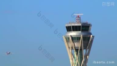 机场控制塔台处于全容量雷达控制塔台，一架飞机横越天空